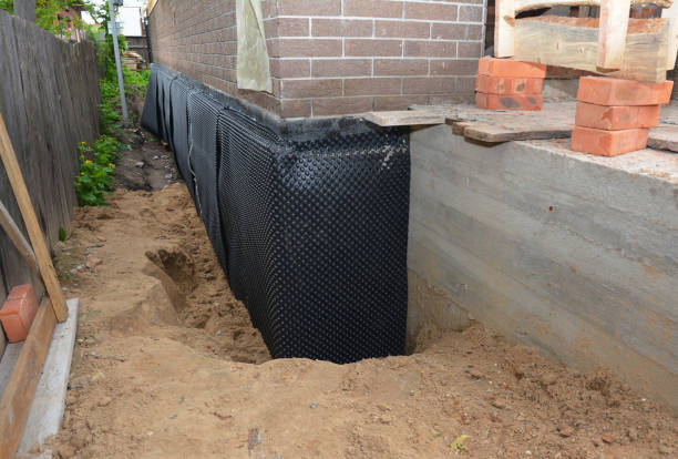 SJ Waterproofing Pros technician performing targeted Interior Drainage System assessment in Malvern, AL